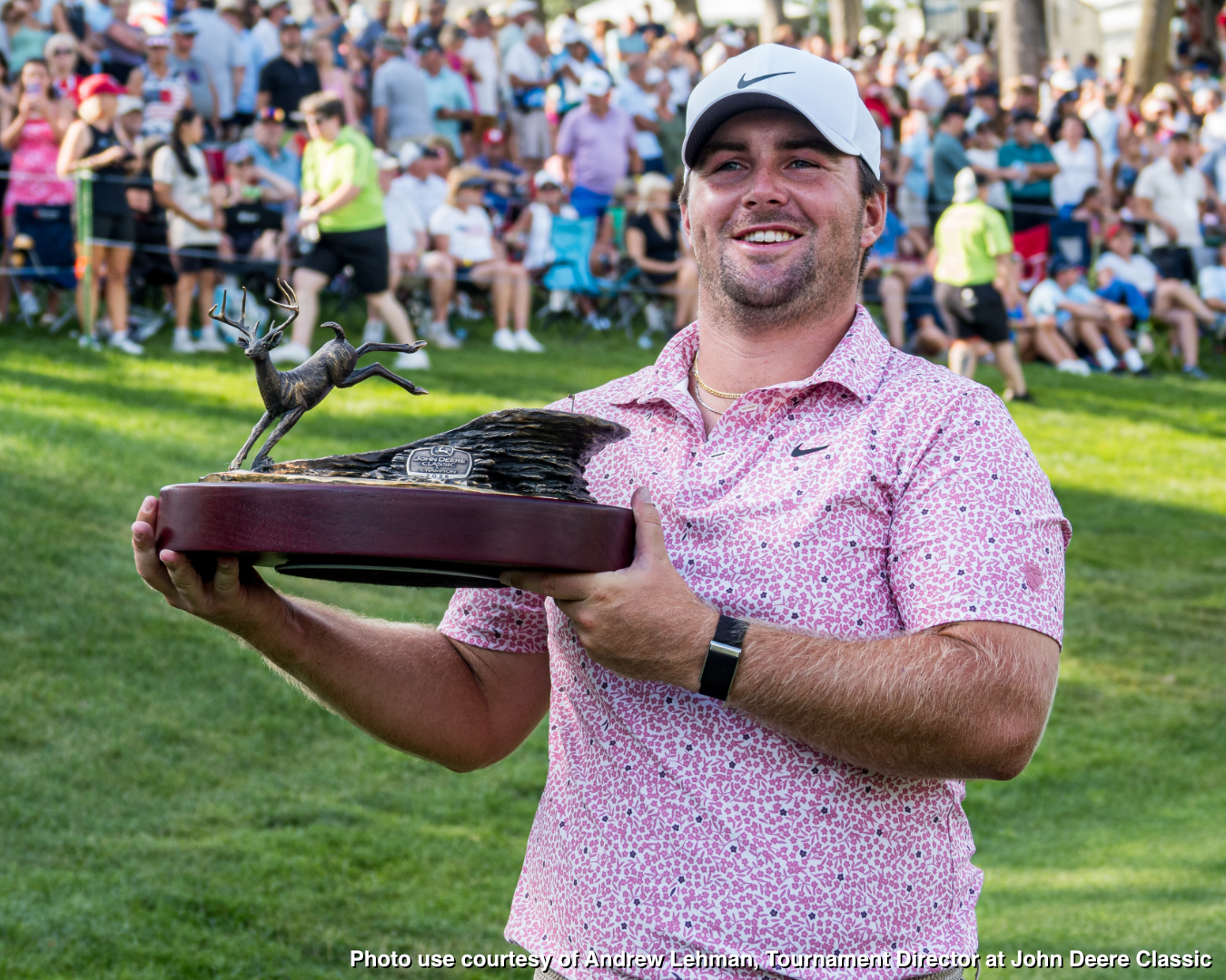 2026 John Deere Champion Chris Gotterup holding trophy made by Malcolm DeMille